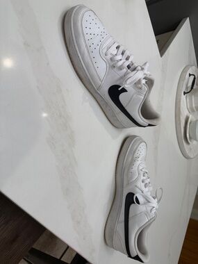 Nike White Low-Top Sneakers with Black Swoosh